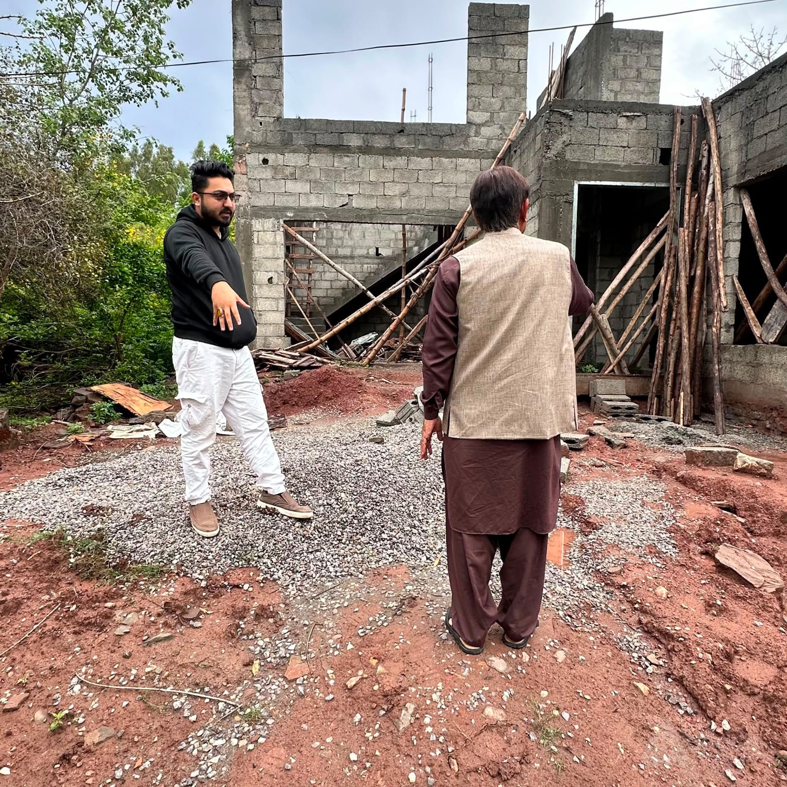 Business handshake at a construction site