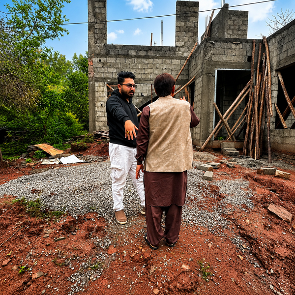 Address Solutions consultant discussing a project on-site with a client