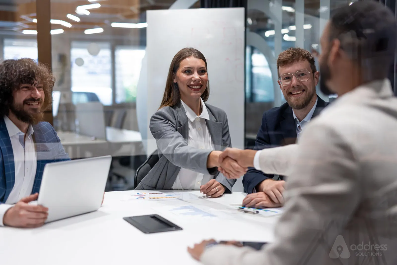 Business partners shaking hands after a successful meeting
