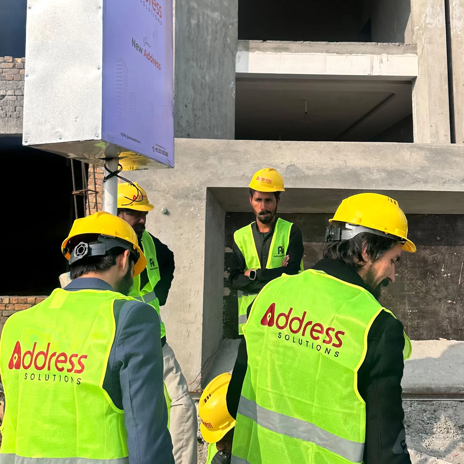 Client and consultant reviewing project blueprints